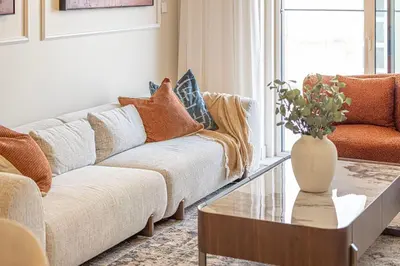 a living room with a couch and a coffee table at Classy Stay at Beach Mansion with Private Beach in Dubai