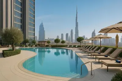 a swimming pool with chairs and umbrellas in a city at Vida Dubai Mall 1BR apt - Connected to Dubai Mall in Dubai
