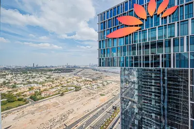 a view of a tall building with a sign on it at Vida Dubai Mall 1BR apt - Connected to Dubai Mall in Dubai