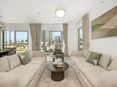 a living room with a couch and a table at By Luxury Space I Luxury two Bedroom Apartment I Front row Downtown with Private Fountain View in Dubai
