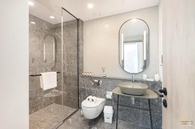 a bathroom with a shower and a sink and a toilet at 35 eme étage panoramique vue mer ,vue Burj Khalifa et Burj el araabe in Dubai
