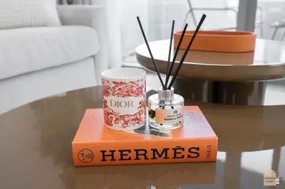 a coffee table with a thermos on top of a box at 35 eme étage panoramique vue mer ,vue Burj Khalifa et Burj el araabe in Dubai