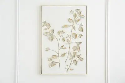 a framed drawing of flowers on a white wall at Luxury Studio with Pool and Parking at Azizi Vista in Dubai