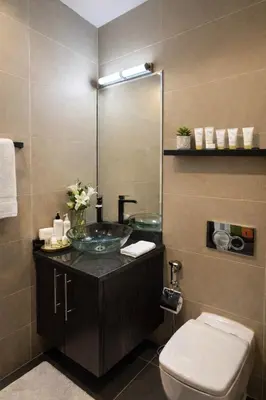 a bathroom with a sink and a toilet at Artistic Studio in Cayan Tower with Marina Views in Dubai
