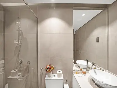 a bathroom with a shower and a toilet and a sink at keylid Premium 1BR Apartment Dubai Marina in Dubai