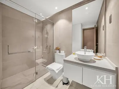 a bathroom with a toilet and a sink and a shower at keylid Premium 1BR Apartment Dubai Marina in Dubai