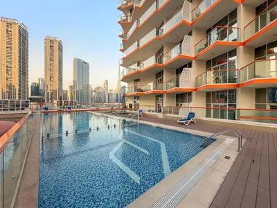 a swimming pool on the side of a building at FIRST CLASS Studio Canal & Burj Khalifa View in Dubai