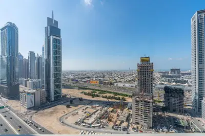 an aerial view of a city with tall buildings at Elegant 2Bed Walk to Burj Khalifa & Dubai Mall in Dubai