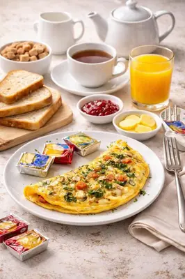 a breakfast table with a plate of omelet and toast at LMY Wharf 2 Marina View Suites - Dubai JBR Marina in Dubai
