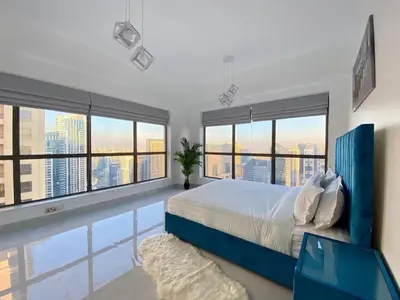 a bedroom with a large bed and a pool at LMY Wharf 2 Marina View Suites - Dubai JBR Marina in Dubai