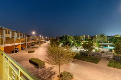 a view of a street at night from a building at FIRST CLASS VILLA Zen Luxe Contemporary Haven in Dubai