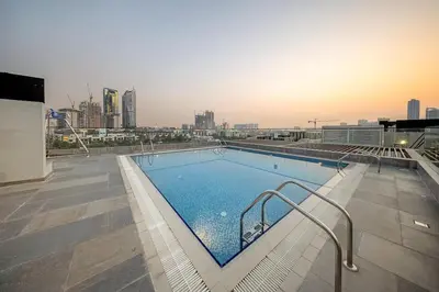a large swimming pool on top of a building at FIRST CLASS 1BR Elegant Cozy Escape in Dubai