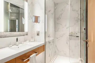 a bathroom with a shower and a sink at FIRST CLASS 2BR Burj Khalifa & Fountain View in Dubai