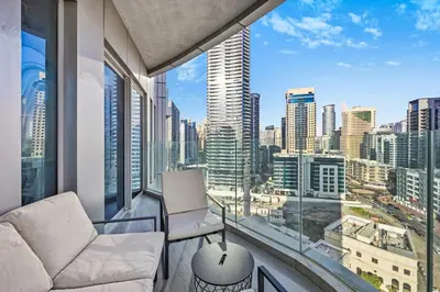 a living room with a couch and a view of the city at Peaceful, Unique 1BR Experience ,Dubai Marina in Dubai