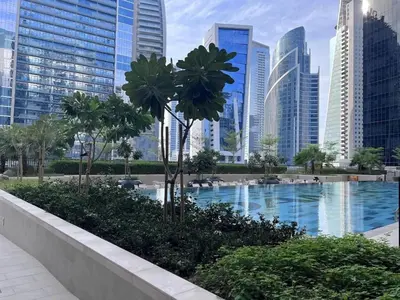 a swimming pool in a city with tall buildings at Premium 1 BDR in Zada Tower-Business Bay in Dubai
