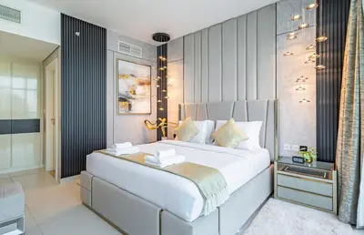 a bedroom with a large bed in a room at Ultra-Luxe Breathtaking Canal Views l Business Bay in Dubai