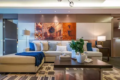 a living room with a couch and a table at City View Lux 1 BR in Creek Heights Upgraded by UDH in Dubai