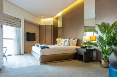 a hotel room with a bed and a television at City View Lux 1 BR in Creek Heights Upgraded by UDH in Dubai