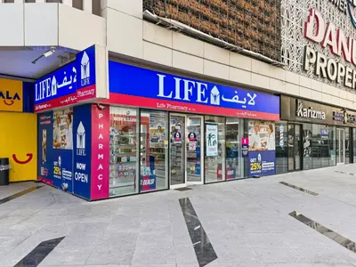 an empty street in front of a store at Bayz by Denube in Dubai