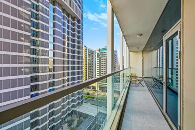 a balcony in a building with a view of a city at Bayz by Denube in Dubai