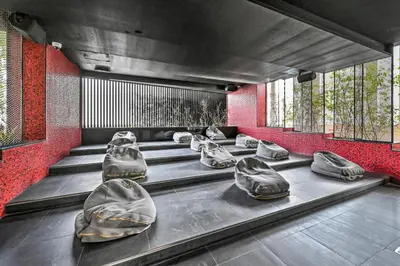 a row of seats in a waiting room at Bayz by Denube in Dubai