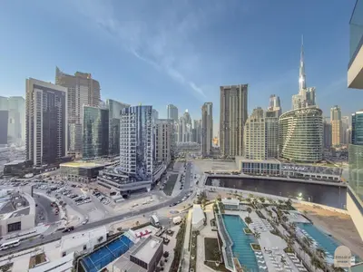 a view of a city with tall buildings at Réveille Face au Burj Khalifa Vu Canal & Piscine in Dubai