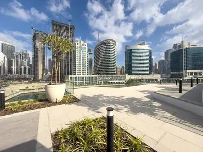 a view of a city skyline with tall buildings at Réveille Face au Burj Khalifa Vu Canal & Piscine in Dubai