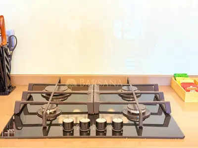 a stove top oven in a kitchen with a chalkboard at Barsana - Seabreeze Suite - 2 Bed - Sea Views in Dubai