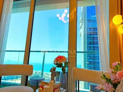 a room with a window with a view of the ocean at Barsana - Seabreeze Suite - 2 Bed - Sea Views in Dubai