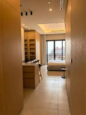 a bedroom with a bed and a desk in a room at Palm Horizon | Luxury Anantara Studio in Dubai