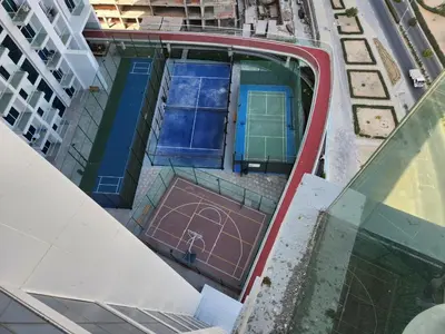 an overhead view of a tennis court on a building at Brand new Studio in Skyz by Danube Arjan in Dubai