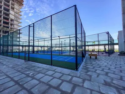 a batting cage with a tennis court in it at Brand new Studio in Skyz by Danube Arjan in Dubai