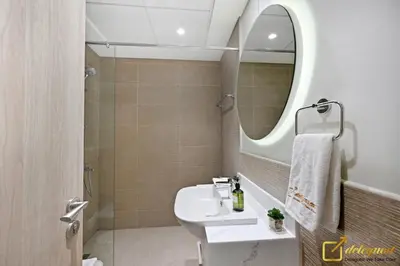 a bathroom with a sink and a mirror at Luxury Studio in Dubai Hills by Deleguest in Dubai
