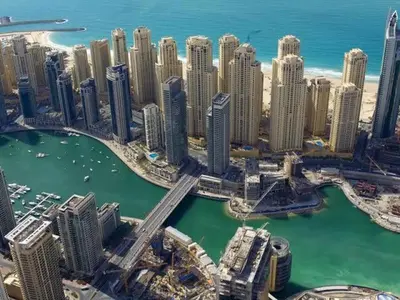 an aerial view of a city with tall buildings at Jumeirah Beach Luxury Collective in Dubai