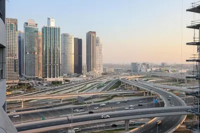 a highway in a large city with traffic on it at Casa Aruri,1B Marina Escape Near Metro and Marina Mall in Dubai