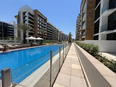 a swimming pool in the middle of a building at Chic French-Riviera Vibe - Burj View 1BR in Dubai