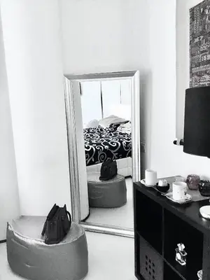 a mirror in a room with a bed in a bedroom at Vip guestroom 360 view of marina private terrace with pool in Dubai