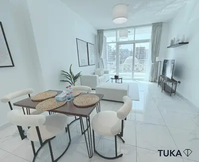 a white living room with a table and chairs at 1-BHK - Brand New Building - Spacious - Central in Dubai
