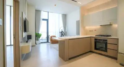 a kitchen with a sink and a stove at Premium 1BR in JVC with Private Pool in Dubai