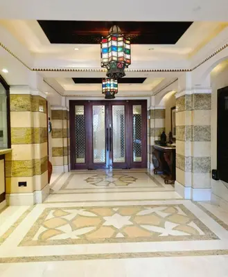 a lobby with a large entry hall with a chandelier at Yansoon 3 Downtown, Dubai in Dubai