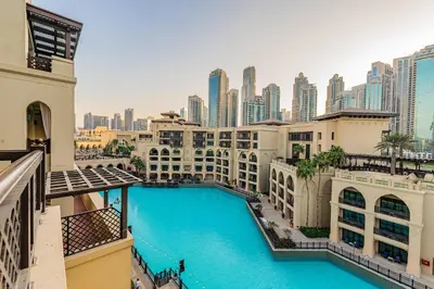 a view of the city from the balcony of a hotel at Escape24 Upgraded 1BR Al Bahar with Partial Burj & Fountain View in Dubai