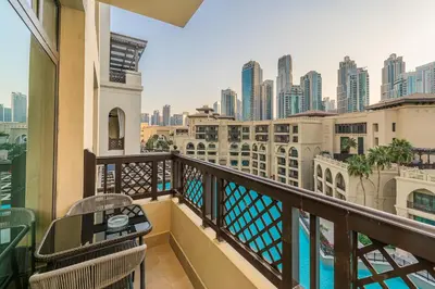 a balcony with a view of the city at Escape24 Upgraded 1BR Al Bahar with Partial Burj & Fountain View in Dubai