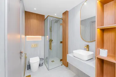 a bathroom with a sink and a toilet and a shower at Escape24 Brand New Designer 2Bedroom with fully Burj Khalifa Views in Dubai