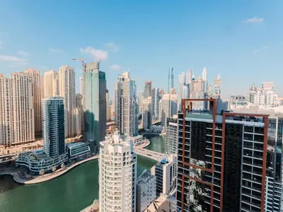 a view of a city with a river and buildings at Quiet Luxury and Views at The Address Dubai Marina in Dubai