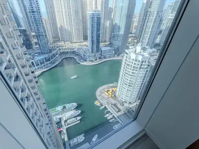 a view of a city from a window in a skyscraper at Quiet Luxury and Views at The Address Dubai Marina in Dubai