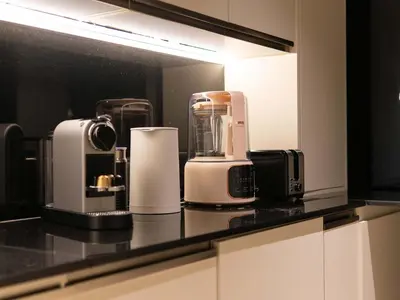 a kitchen counter with two coffee machines on it at Quiet Luxury and Views at The Address Dubai Marina in Dubai