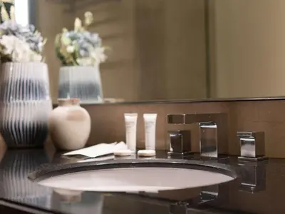 a bathroom counter with a sink and a mirror at Quiet Luxury and Views at The Address Dubai Marina in Dubai