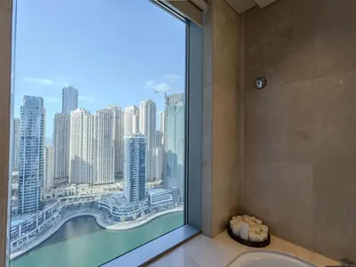 a bathroom with a view of the city from a window at Quiet Luxury and Views at The Address Dubai Marina in Dubai