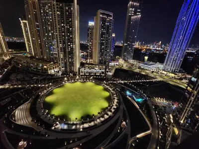 an aerial view of a city at night at Enchanting 2BDR In Creek Harbour 19 in Dubai
