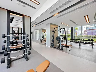 a fitness room with a gym with weights at Enchanting 2BDR In Creek Harbour 19 in Dubai